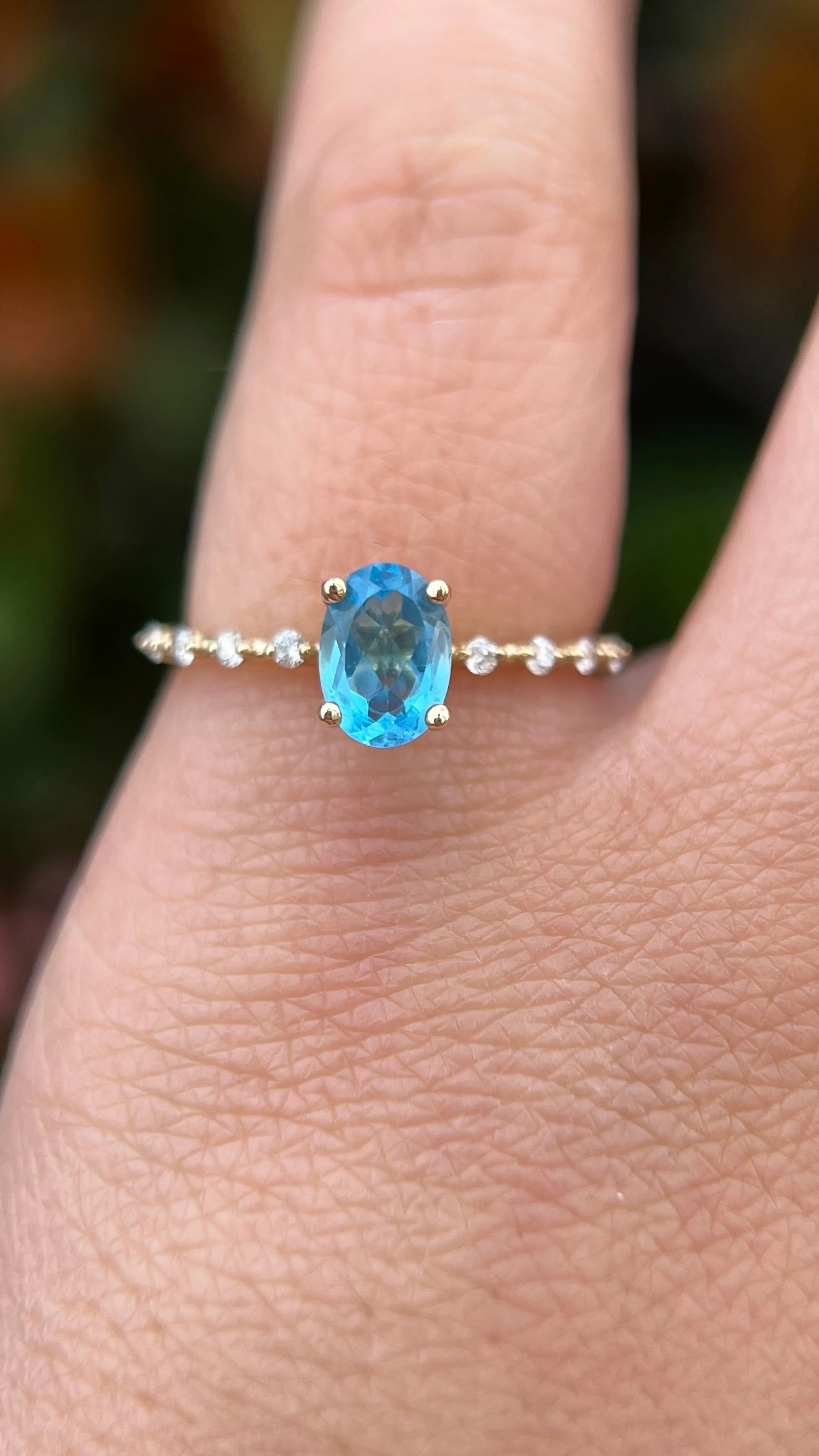 Bella 7x5mm 0.90ct Oval Blue Topaz Spaced Diamond Ring 14K Gold DFR036