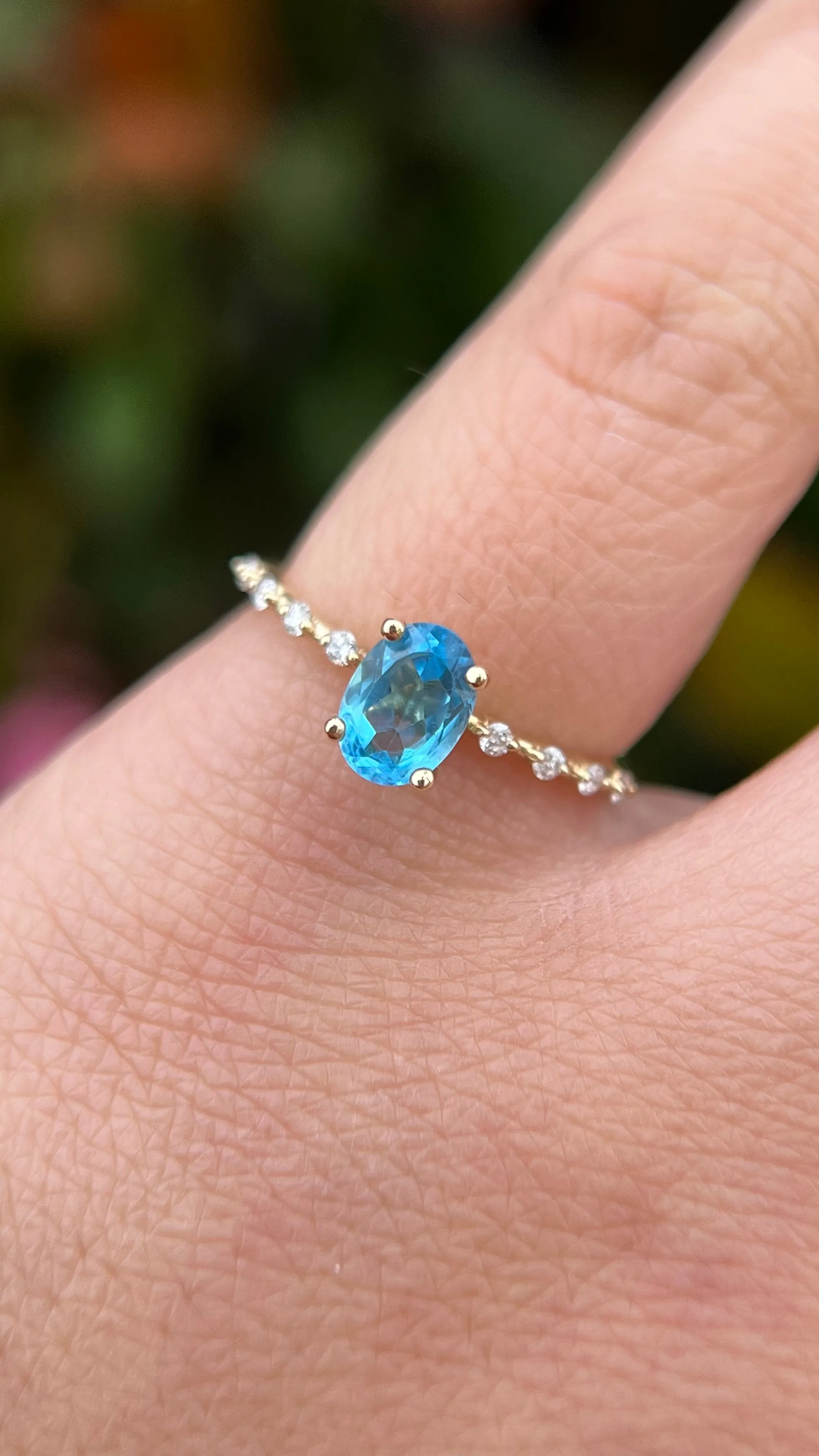 Bella 7x5mm 0.90ct Oval Blue Topaz Spaced Diamond Ring 14K Gold DFR036