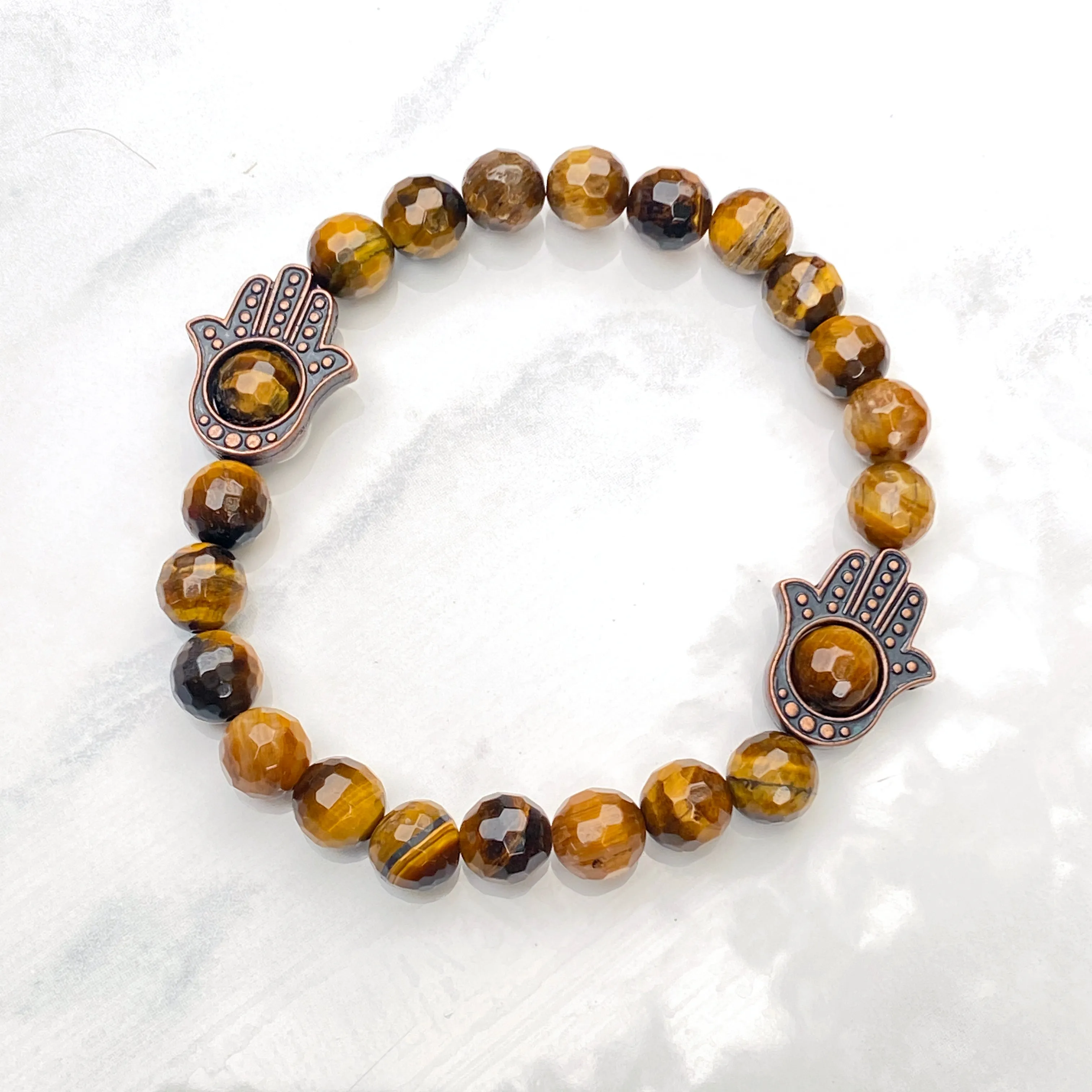 Men's Tiger Eye gemstone and copper Hamsa bracelet.