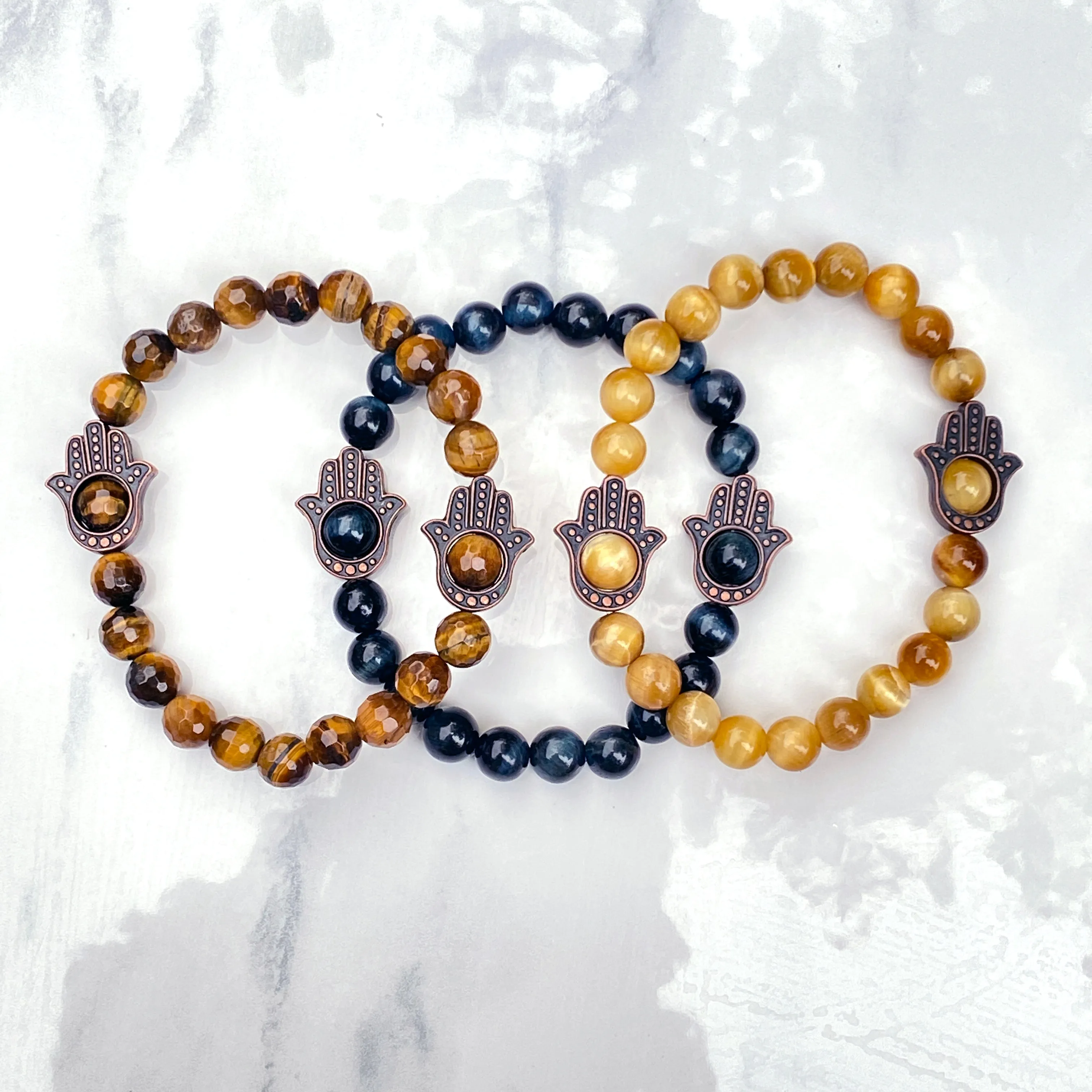 Men's Tiger Eye gemstone and copper Hamsa bracelet.