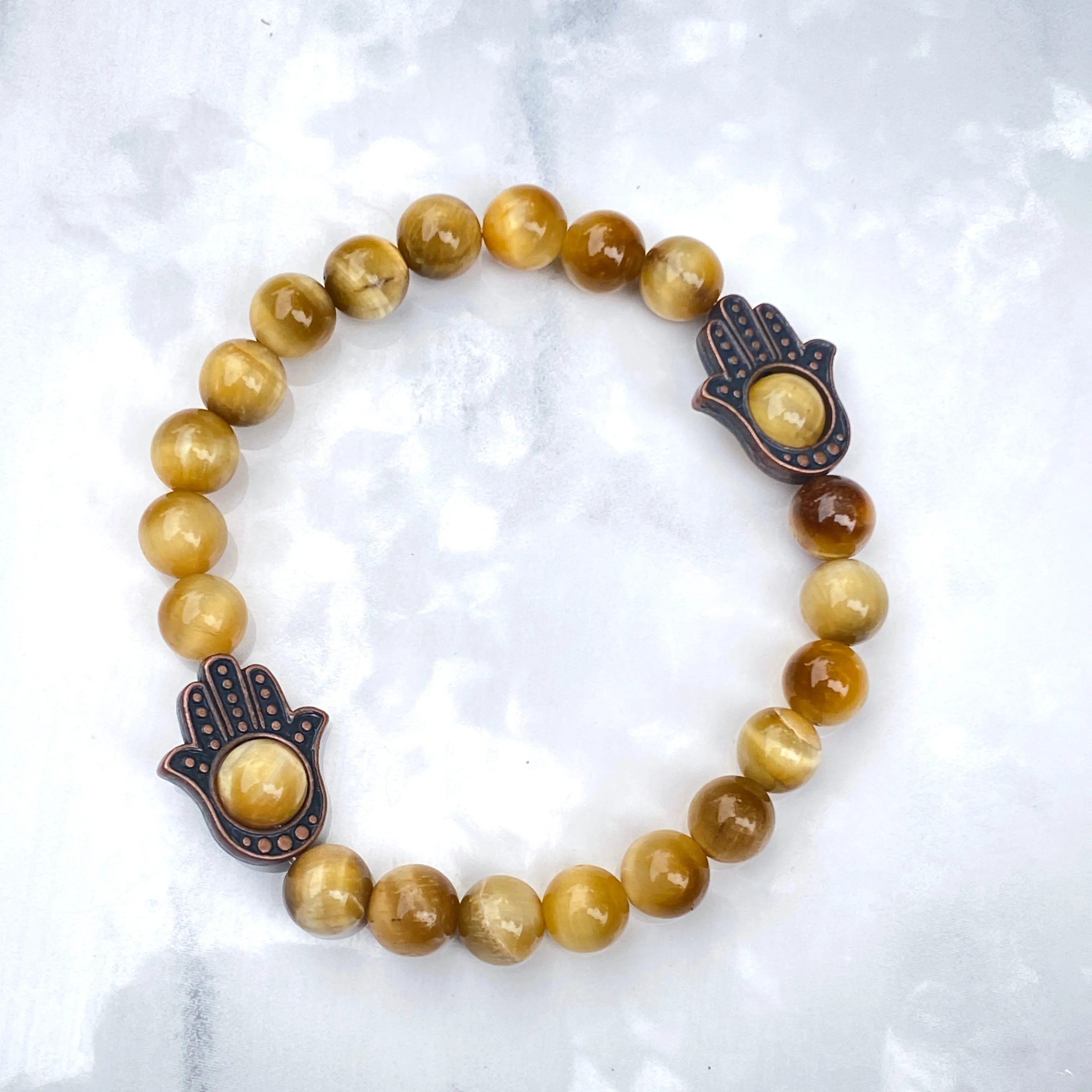 Men's Tiger Eye gemstone and copper Hamsa bracelet.