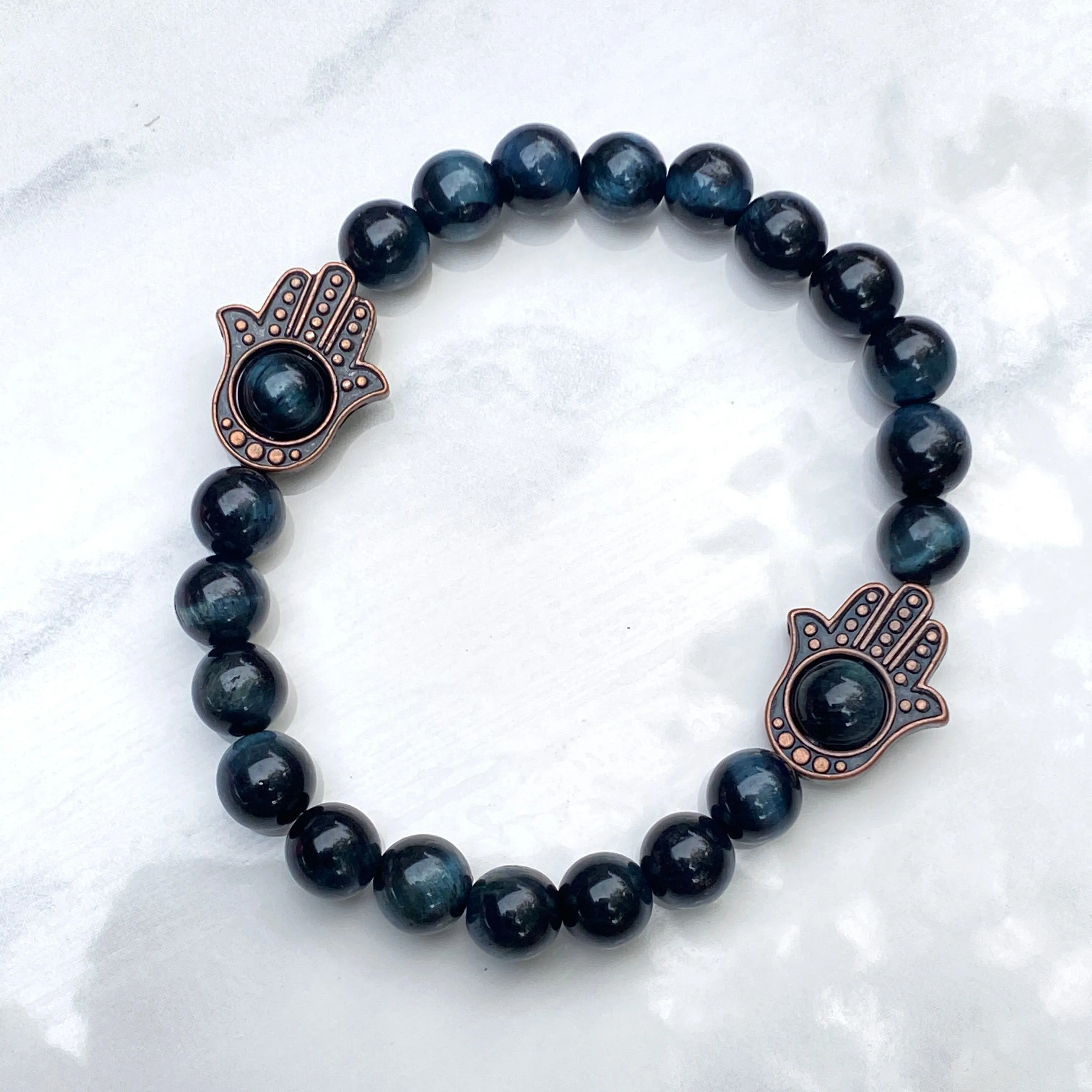 Men's Tiger Eye gemstone and copper Hamsa bracelet.