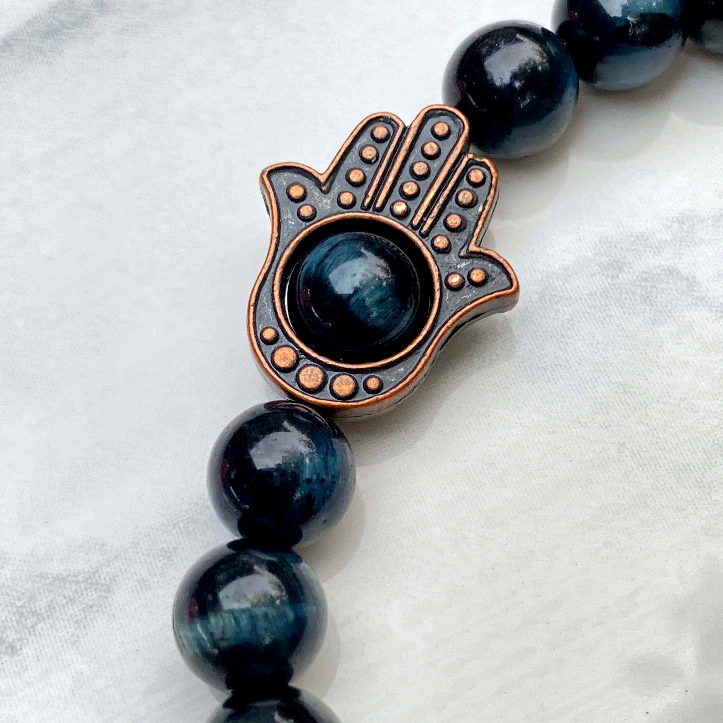 Men's Tiger Eye gemstone and copper Hamsa bracelet.