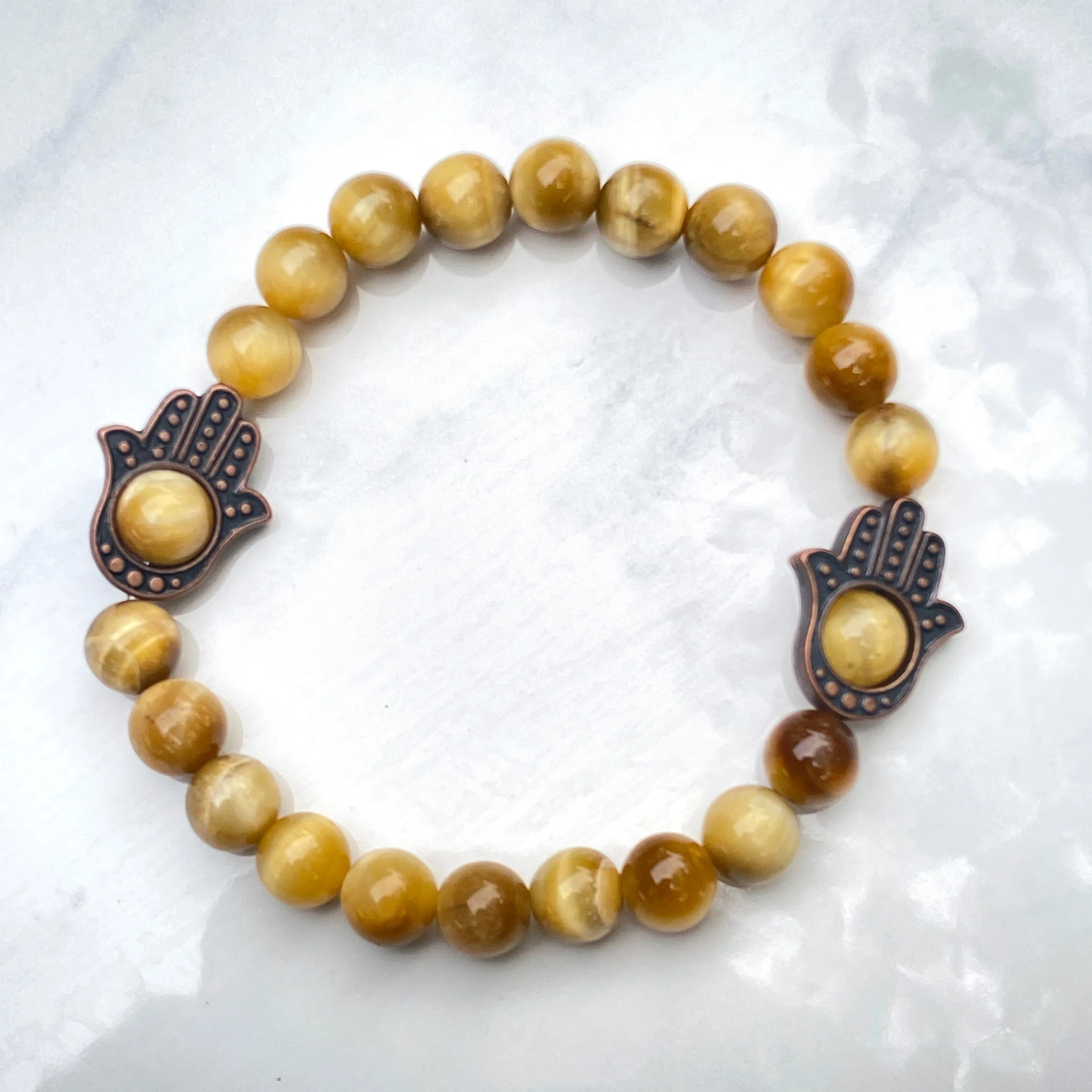 Men's Tiger Eye gemstone and copper Hamsa bracelet.