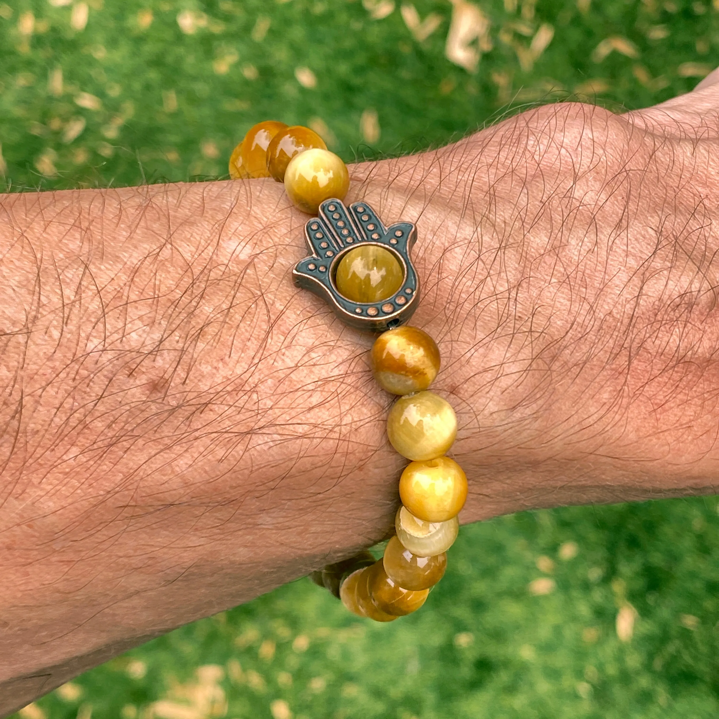 Men's Tiger Eye gemstone and copper Hamsa bracelet.