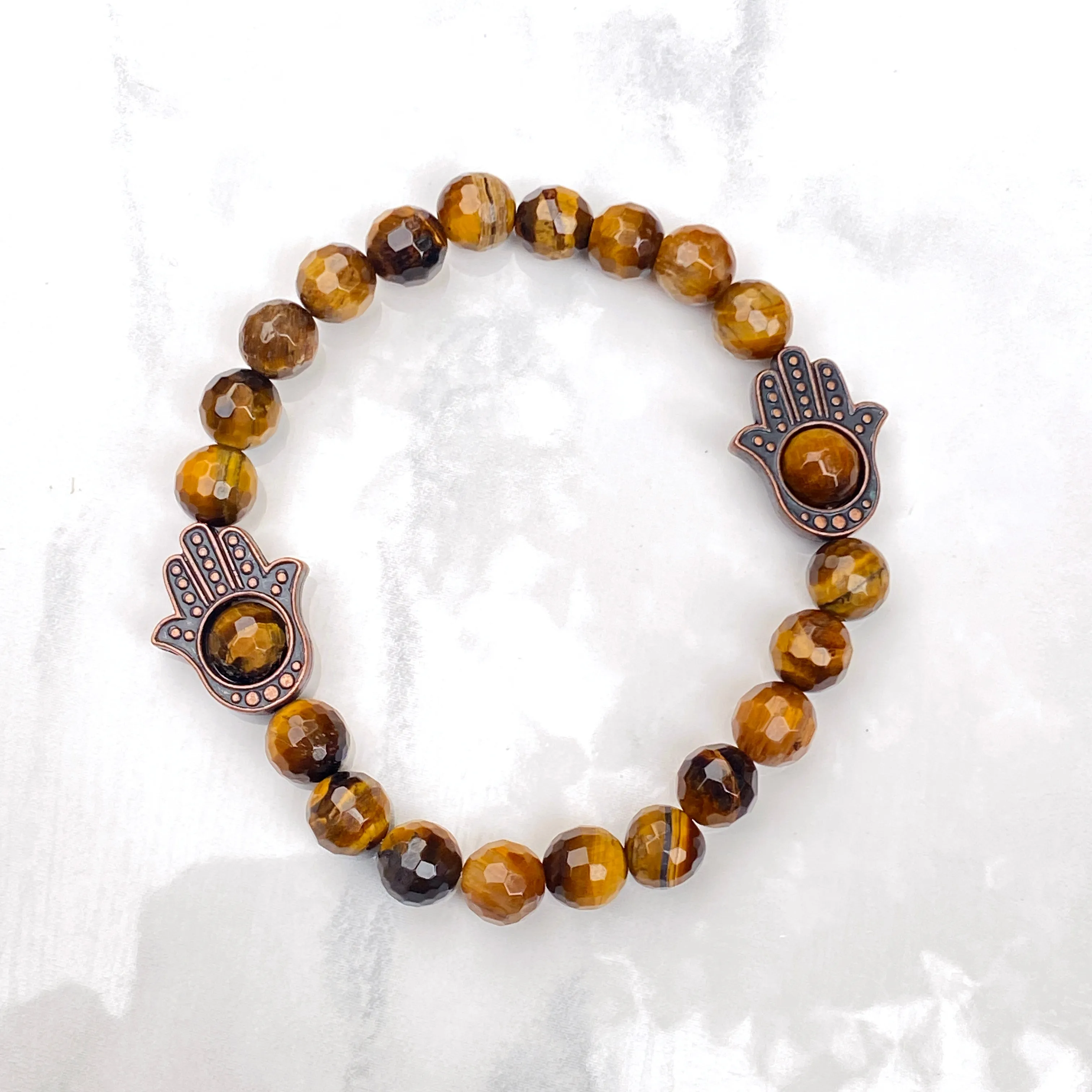 Men's Tiger Eye gemstone and copper Hamsa bracelet.