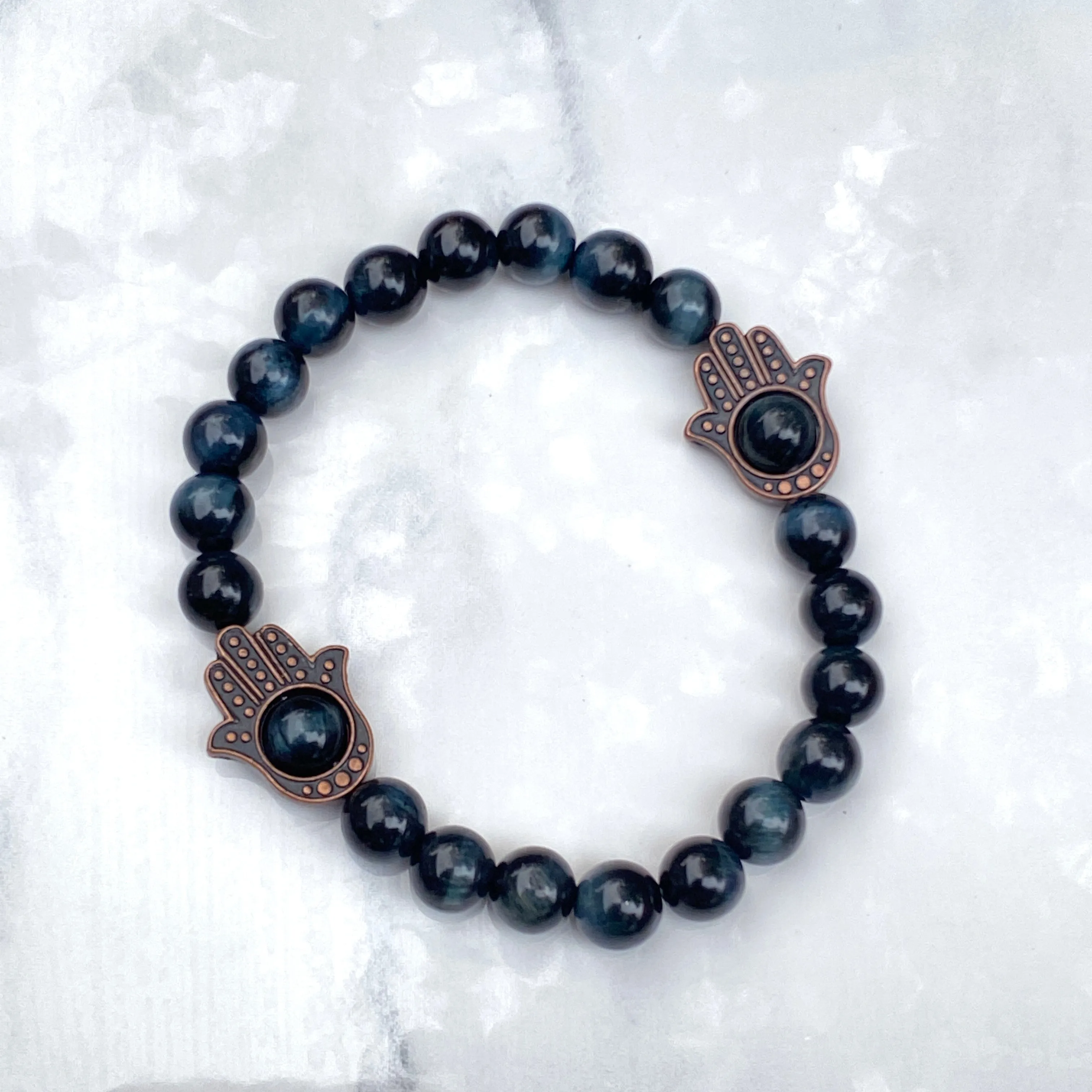 Men's Tiger Eye gemstone and copper Hamsa bracelet.